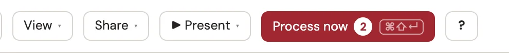 The deck's top bar in watch mode, with a red Process now button showing two comments waiting