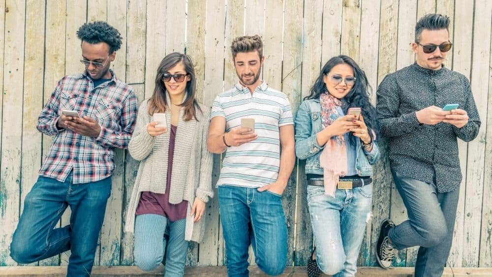 Picture of five people with phone